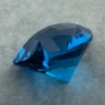 Ярко-голубой топаз отличной российской огранки формы сердце, вес 46.9 карат, размер 23х22.2мм (swiss0045)