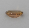 Жёлто-коричневый необлагороженный цоизит формы овал, вес 1.05 кт, размер 7.5х5.5х3.2 мм (tanz0503)